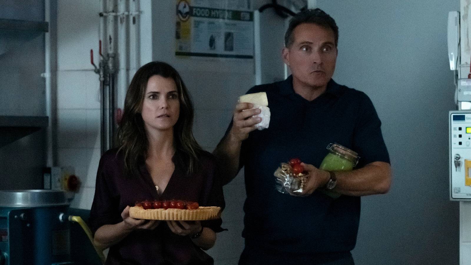 Kate and Hal Stand Holding Food