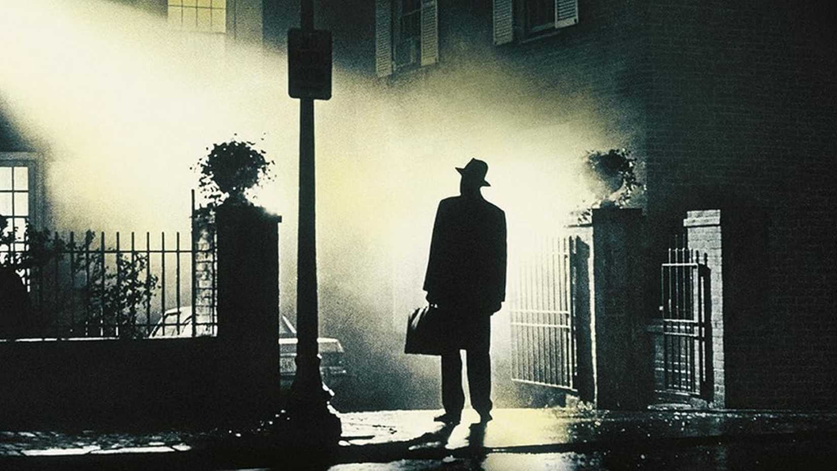 Father Marin stands under a street light in The Exorcist