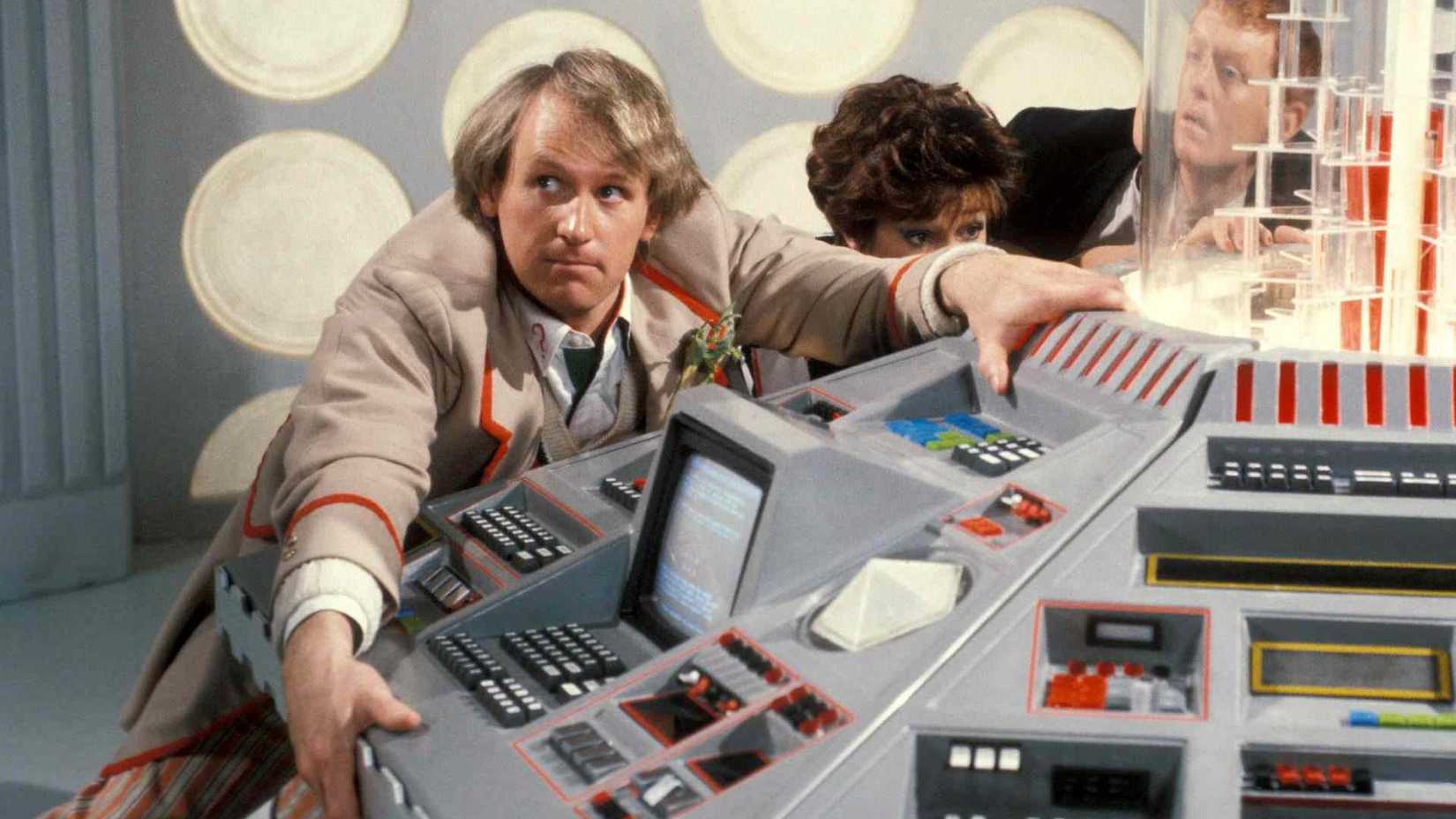 The Fifth Doctor and his companions being thrown around in the TARDIS