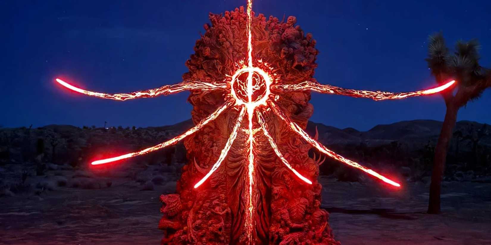 A mysterious statue glows red at night in Joshua Tree, California.
