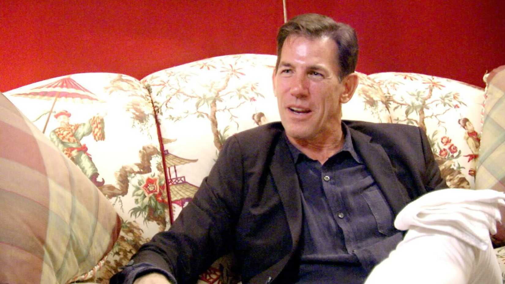 Thomas Ravenel talking on a couch on Southern Charm