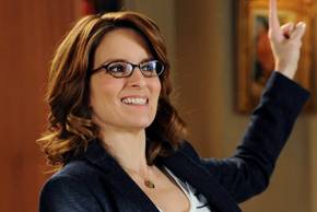Tina Fey grinning in 30 Rock