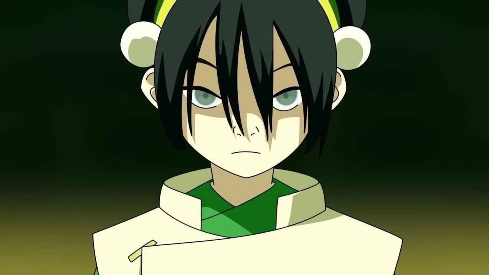Toph looking serious against a green background in Avatar The Last Airbender
