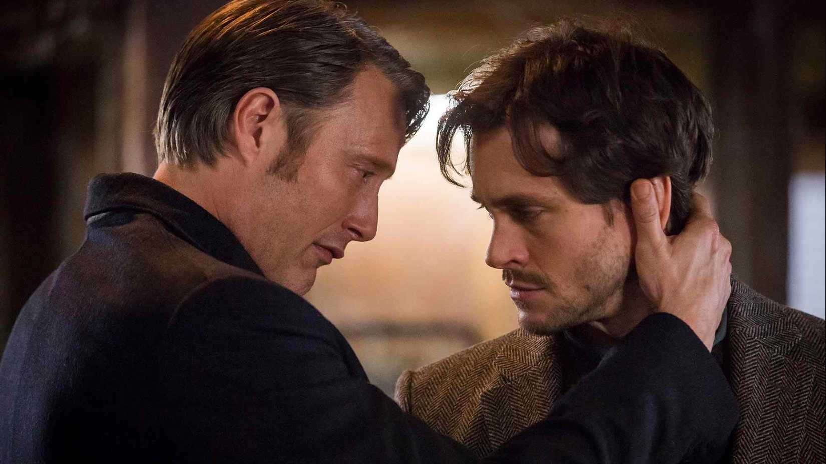 A man holds another man by the neck in Hannibal.