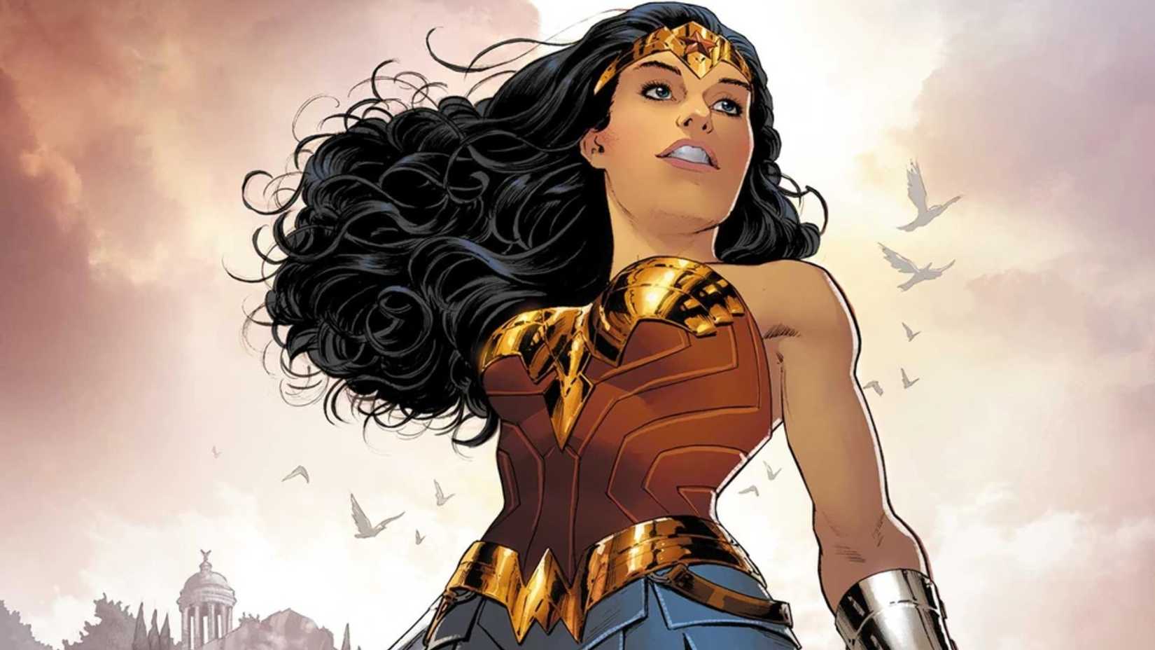 Wonder Woman looking out over the ocean as doves fly overhead.