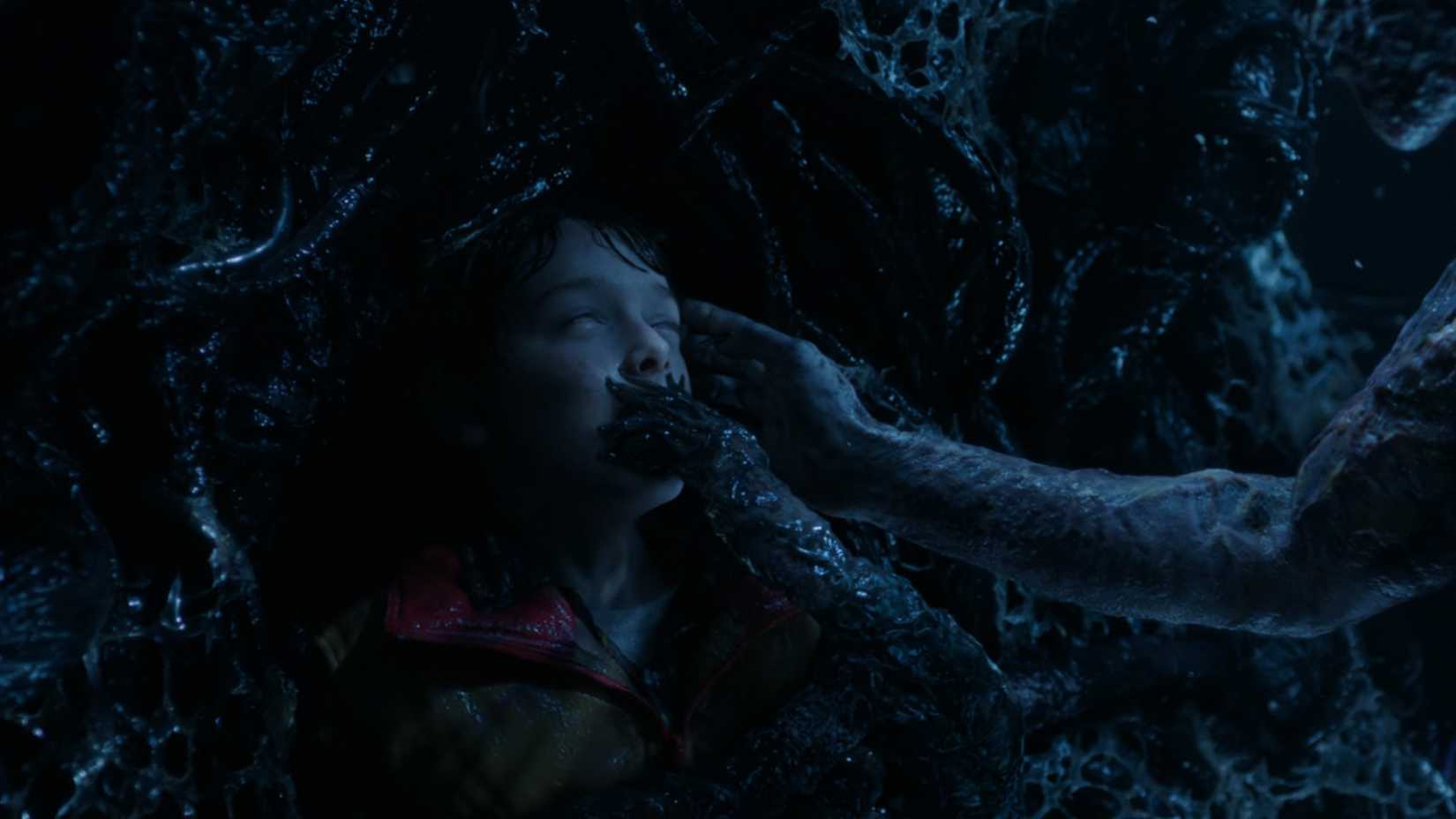 A young Will Byers suffocating in the Upside Down in Stranger Things season 5.