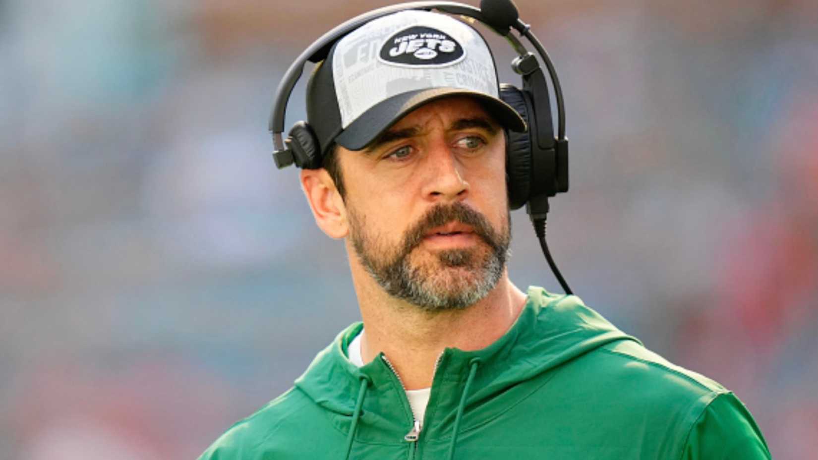 Aaron Rodgers looking intensely while in his Jets coaching gear