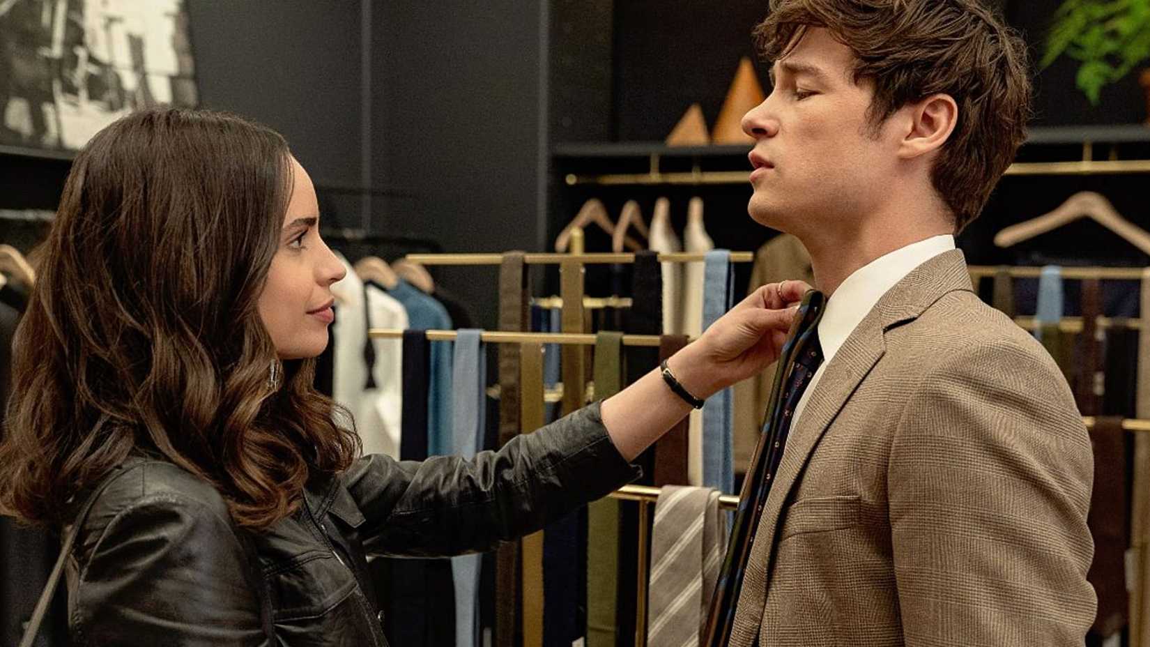 Alex holding up a tie to another character in The Life List