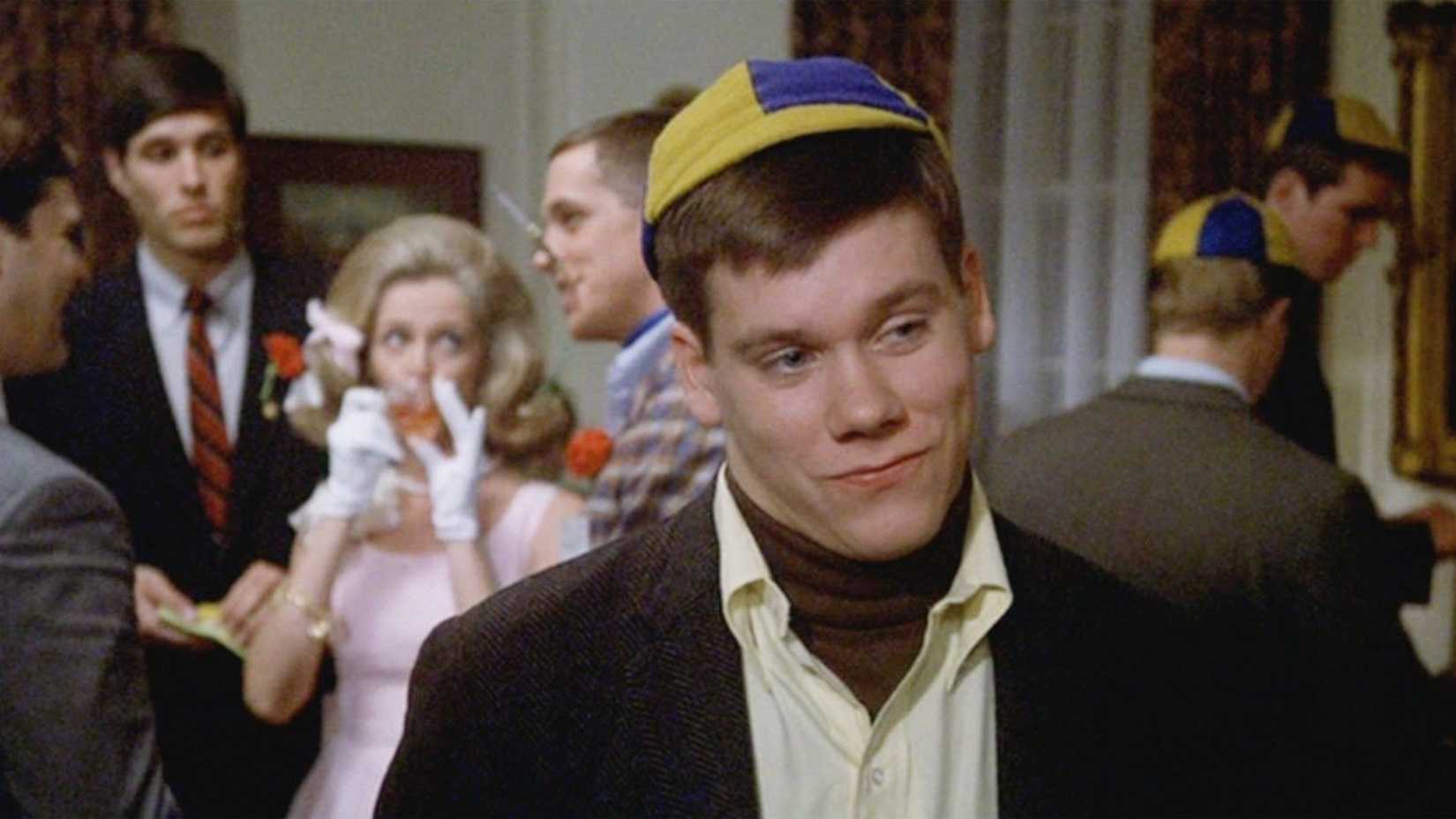 Kevin Bacon smiles smugly in Animal House