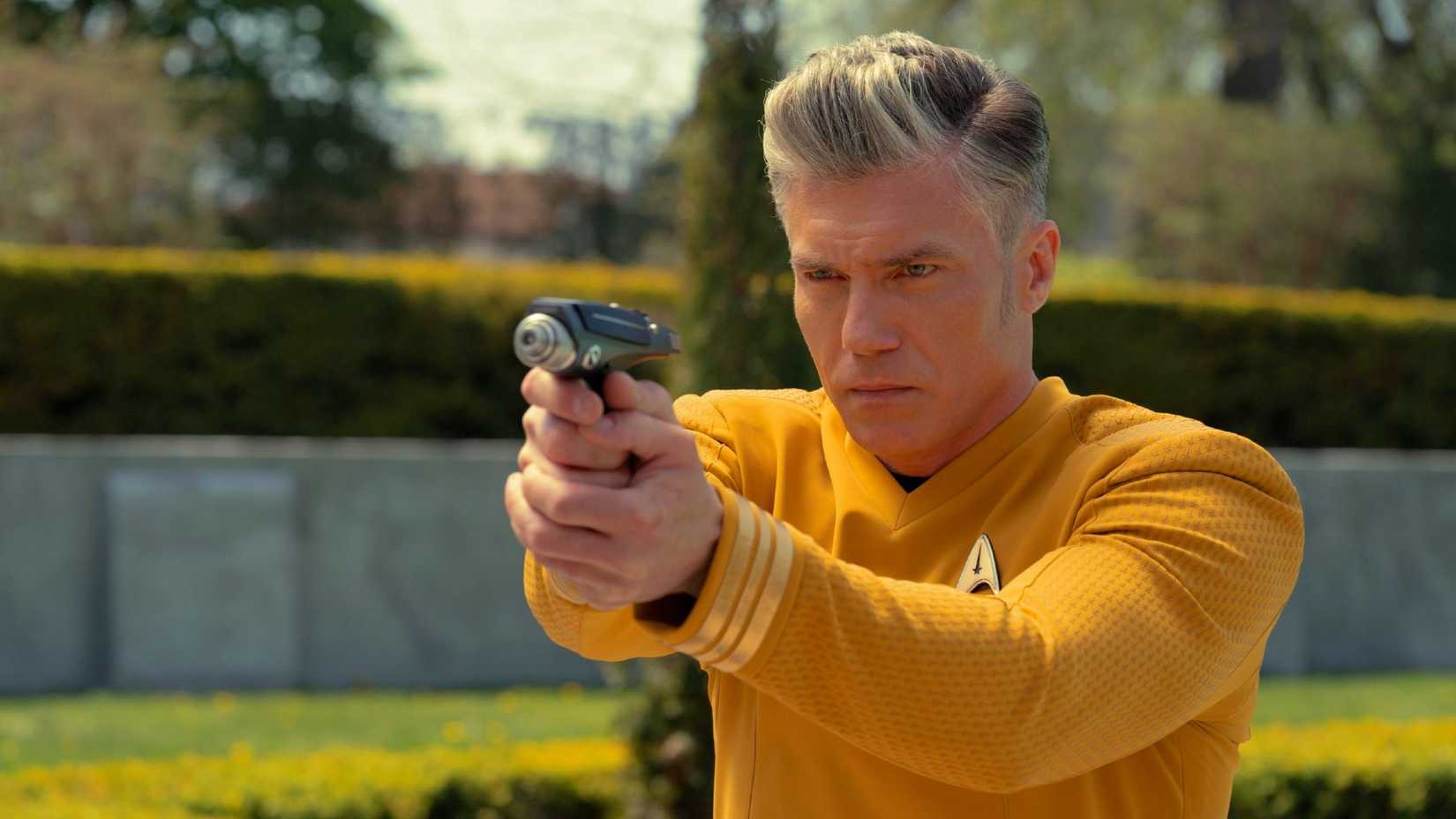 Every Star Trek Series, Ranked By Episode Count 3 Anson Mount as Captain Pike aiming a phaser in Star Trek: Strange New Worlds.