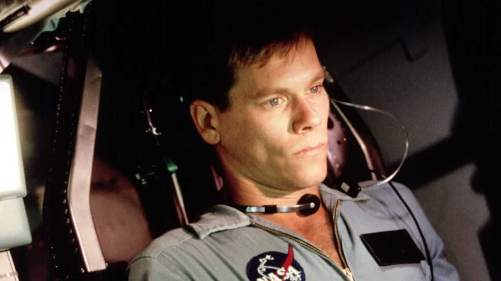 Kevin Bacon looks on intensely in Apollo 13