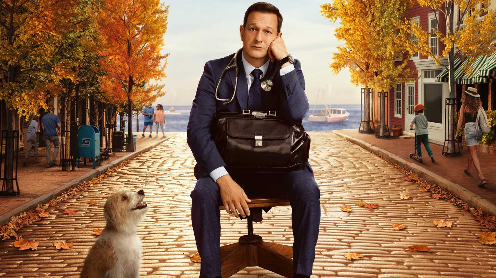 Josh Charles as Dr Martin Best sitting in the street next to his dog in Best Medicine