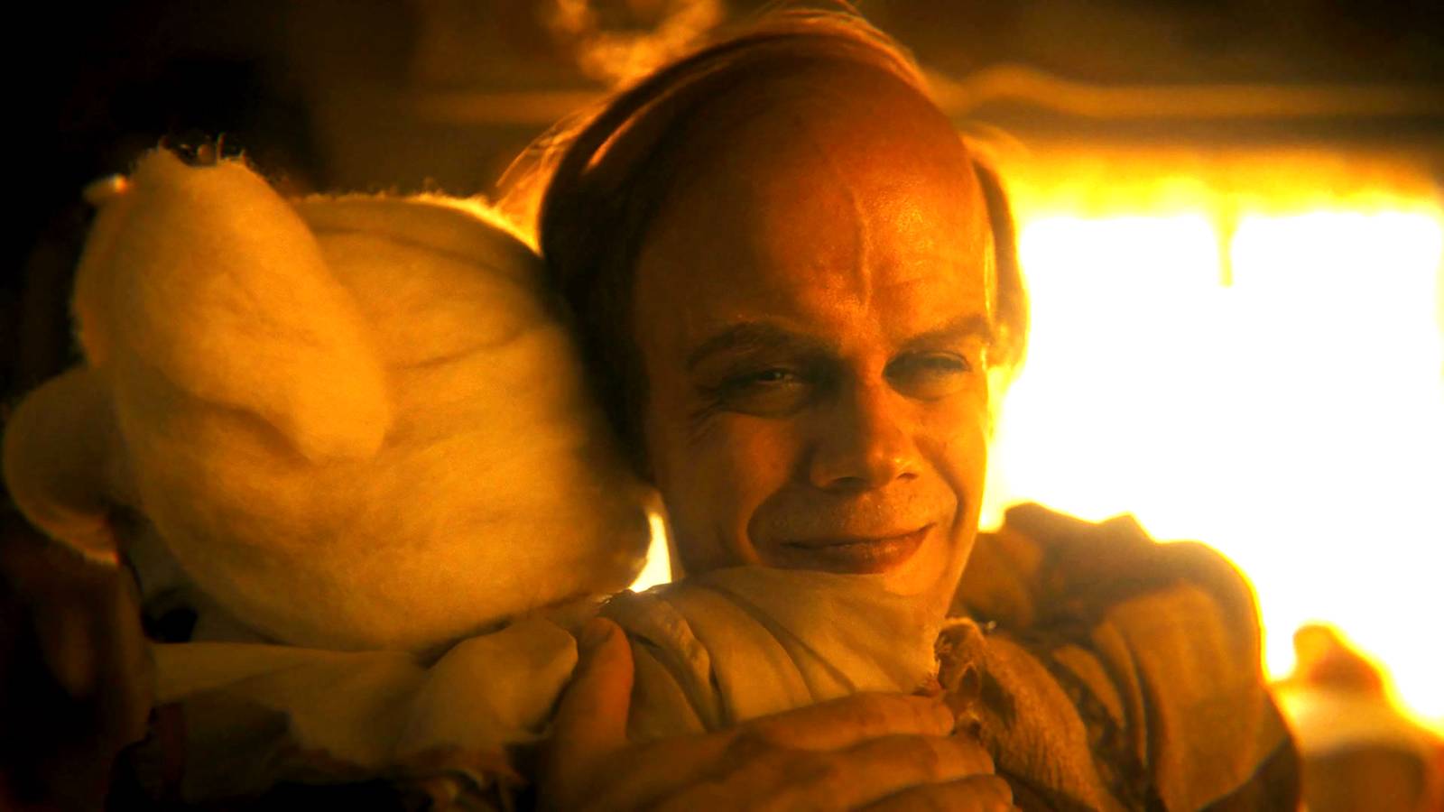 Bill Skarsgård's Bob smiling while hugging his daughter in IT: Welcome to Derry episode 7