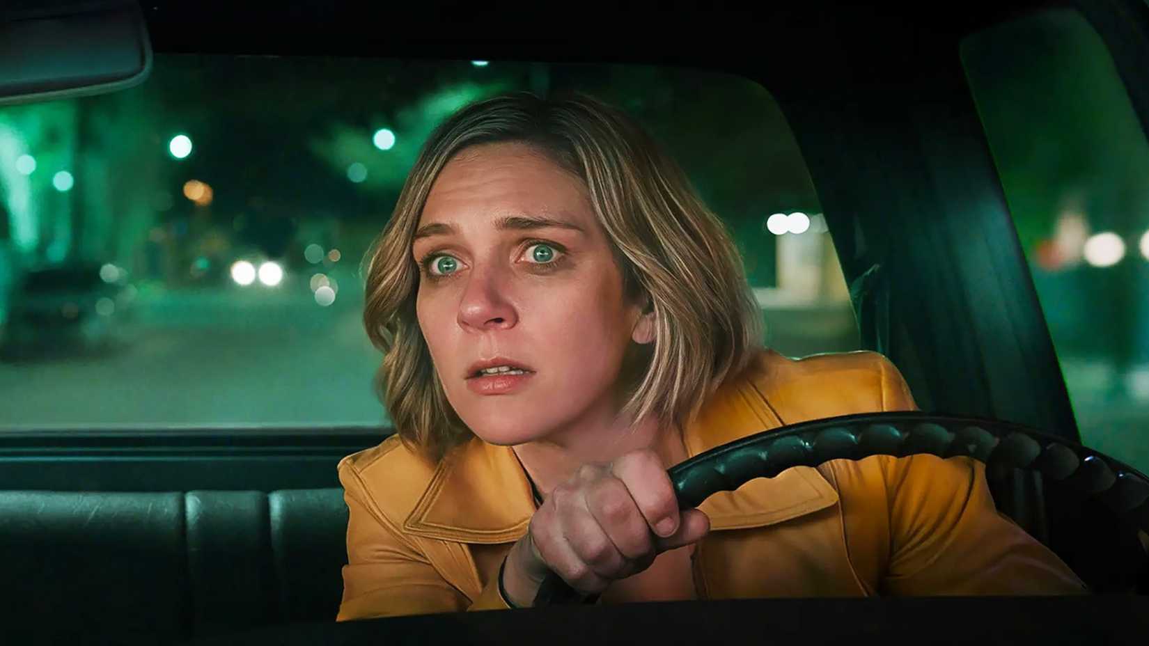 carol looking worried in her car in pluribus