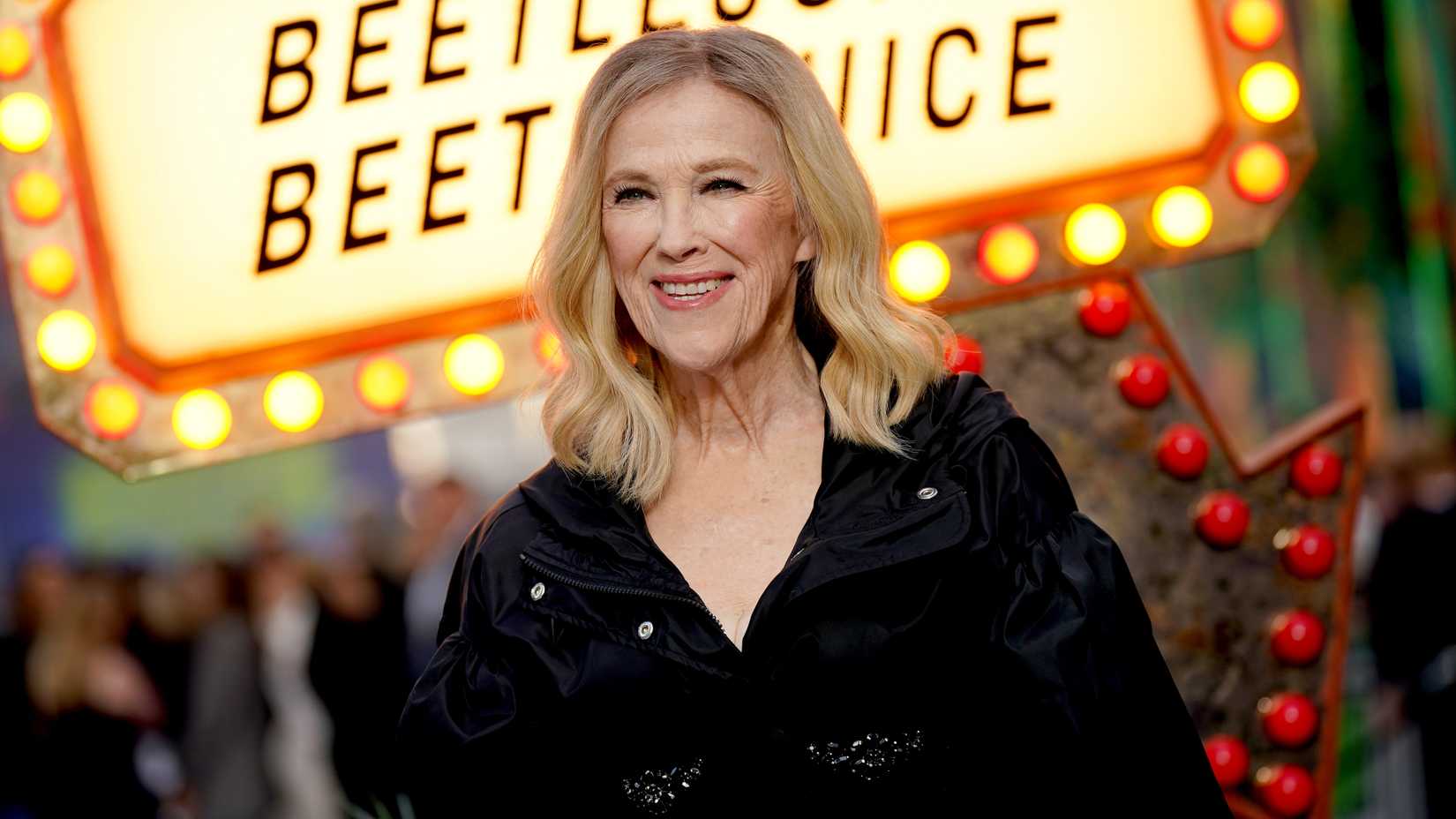 Catherine O'Hara smiling while on the Beetlejuice Beetlejuice red carpet