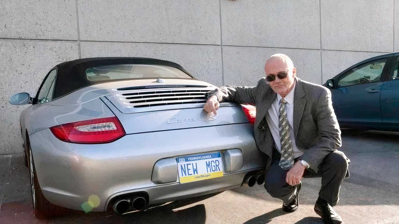 Creed poses by Michael's car in The Office