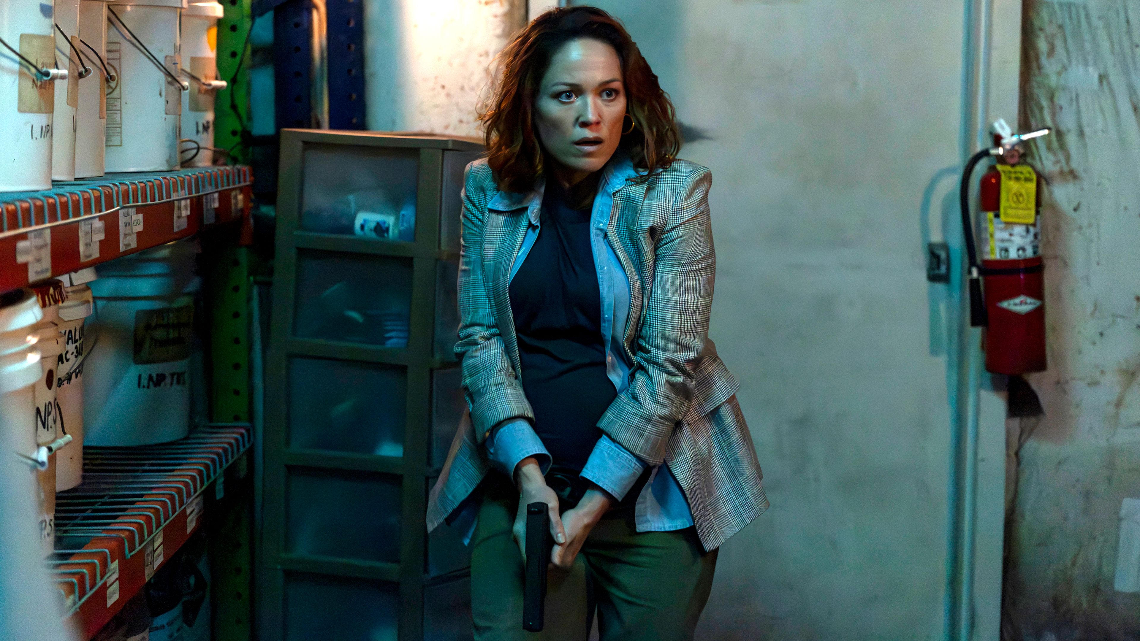 Erika Christensen's Angie looking intensely while holding a gun in Will Trent season 4