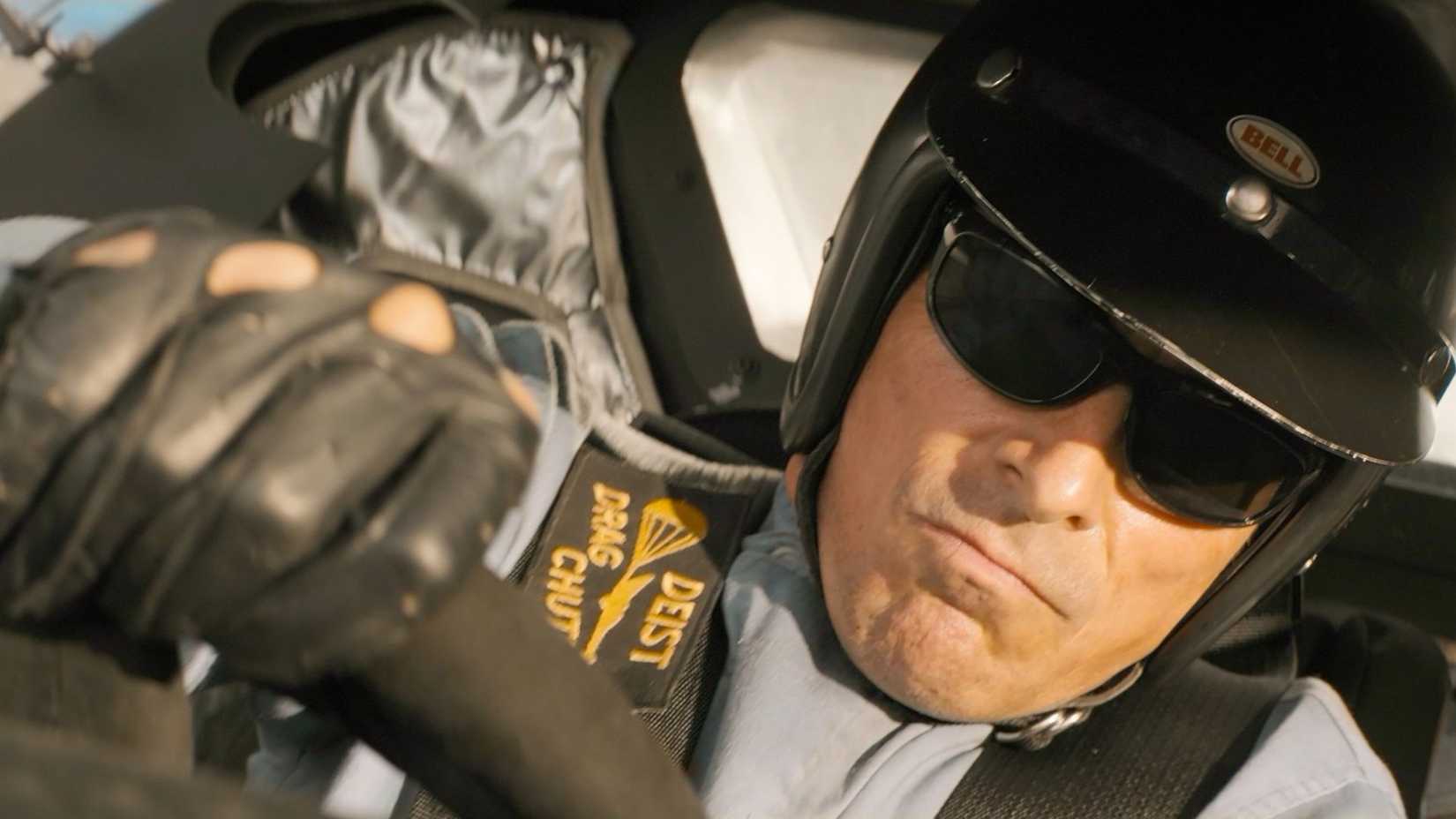 Ken Miles (Christian Bale) driving a car in Ford v Ferrari.
