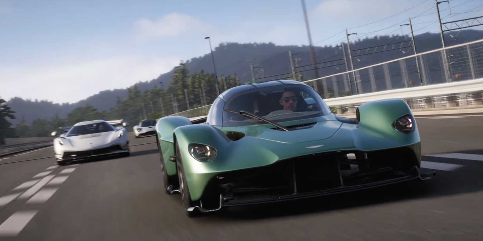 Cars racing toward the camera in Forza Horizon 6.