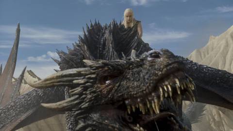 Daenerys (Emilia Clarke) riding Drogon in Game of Thrones.