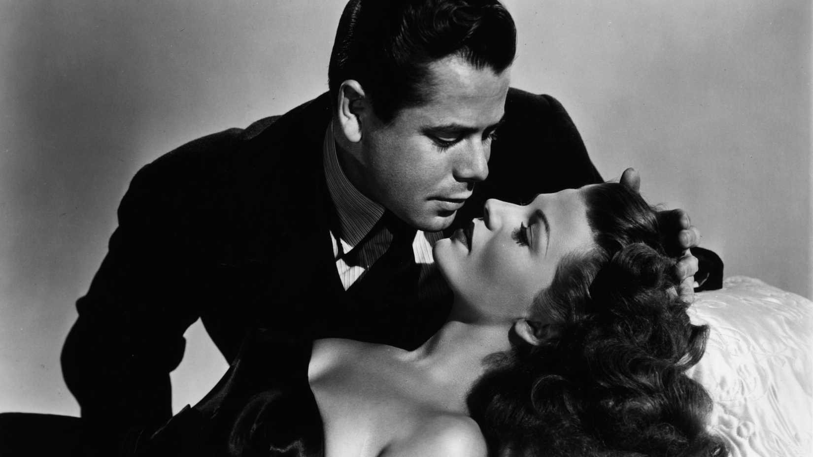 Glenn Ford como Johnny Farrell com Rita Hayworth como Gilda