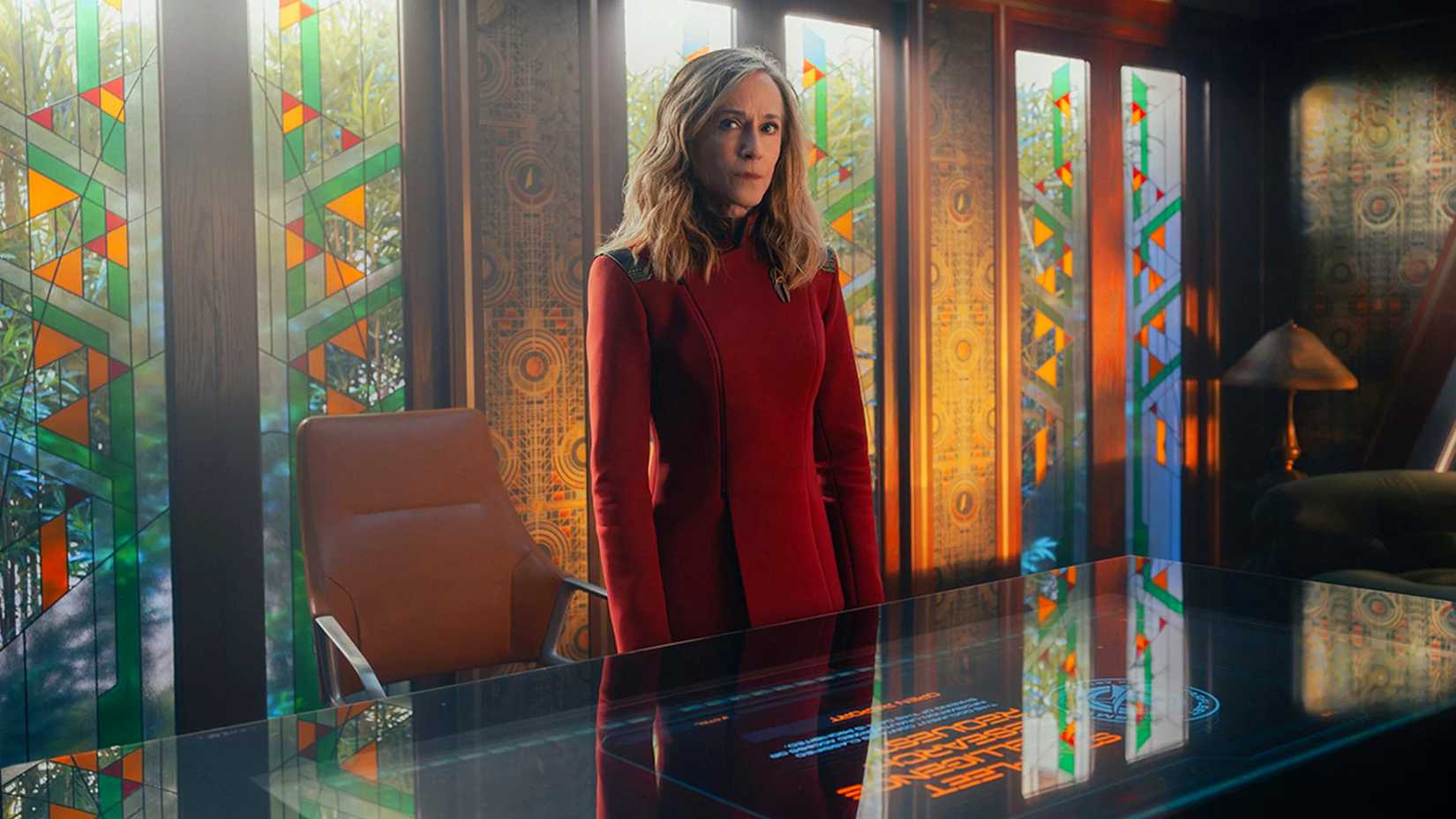 Holly Hunter as Captain Ake standing by her desk in Starfleet Academy.