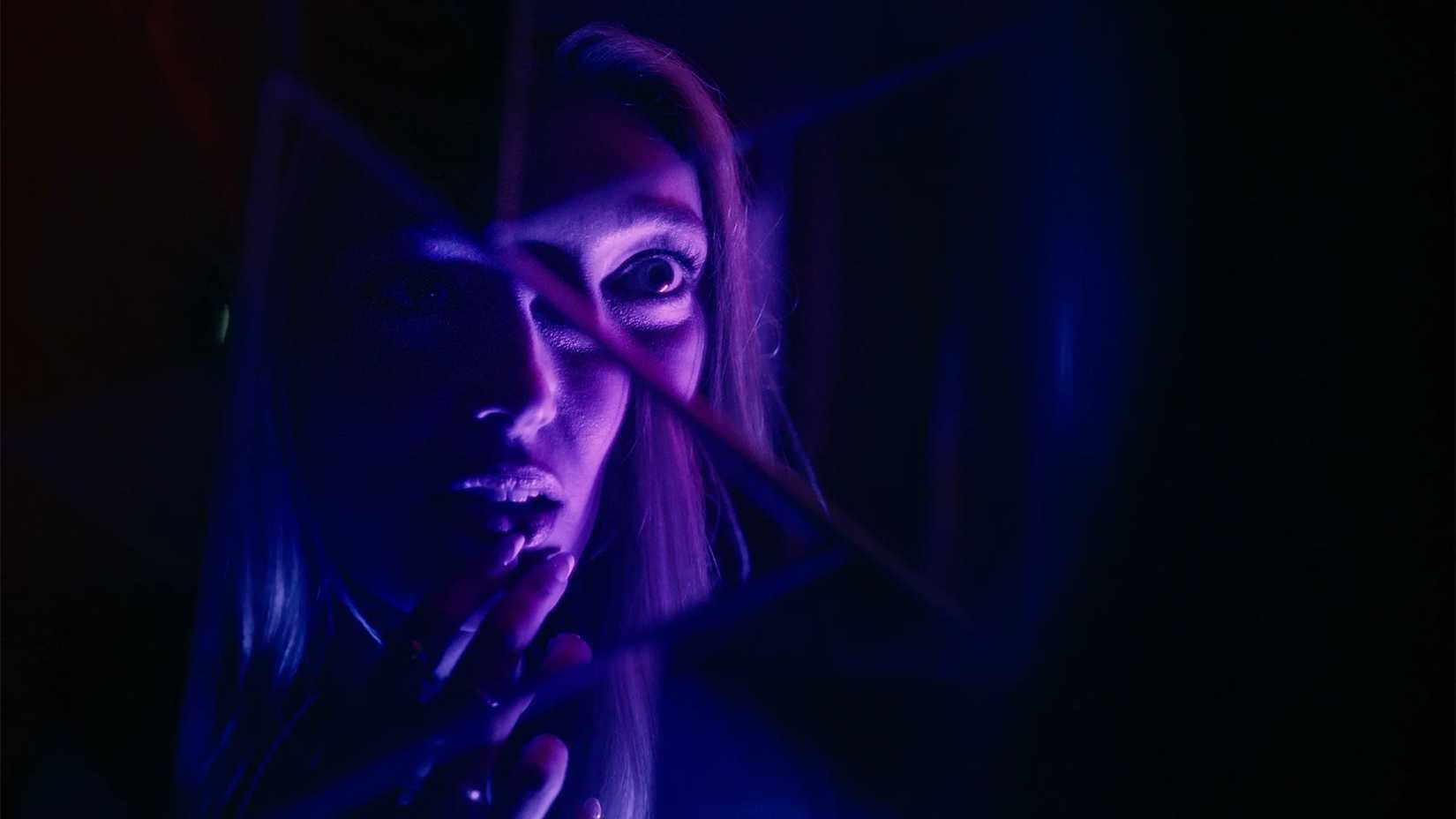 Nikki looks in a cracked mirror in It's What's Inside