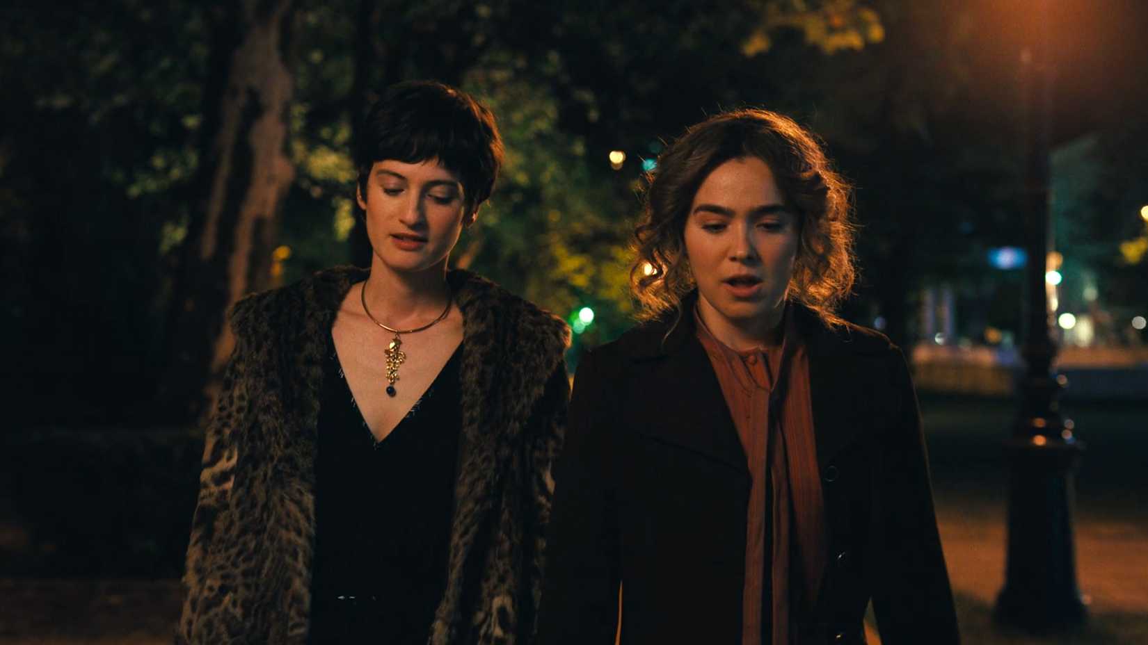 Ivanna and Twila walk down the street together in Ponies season 1