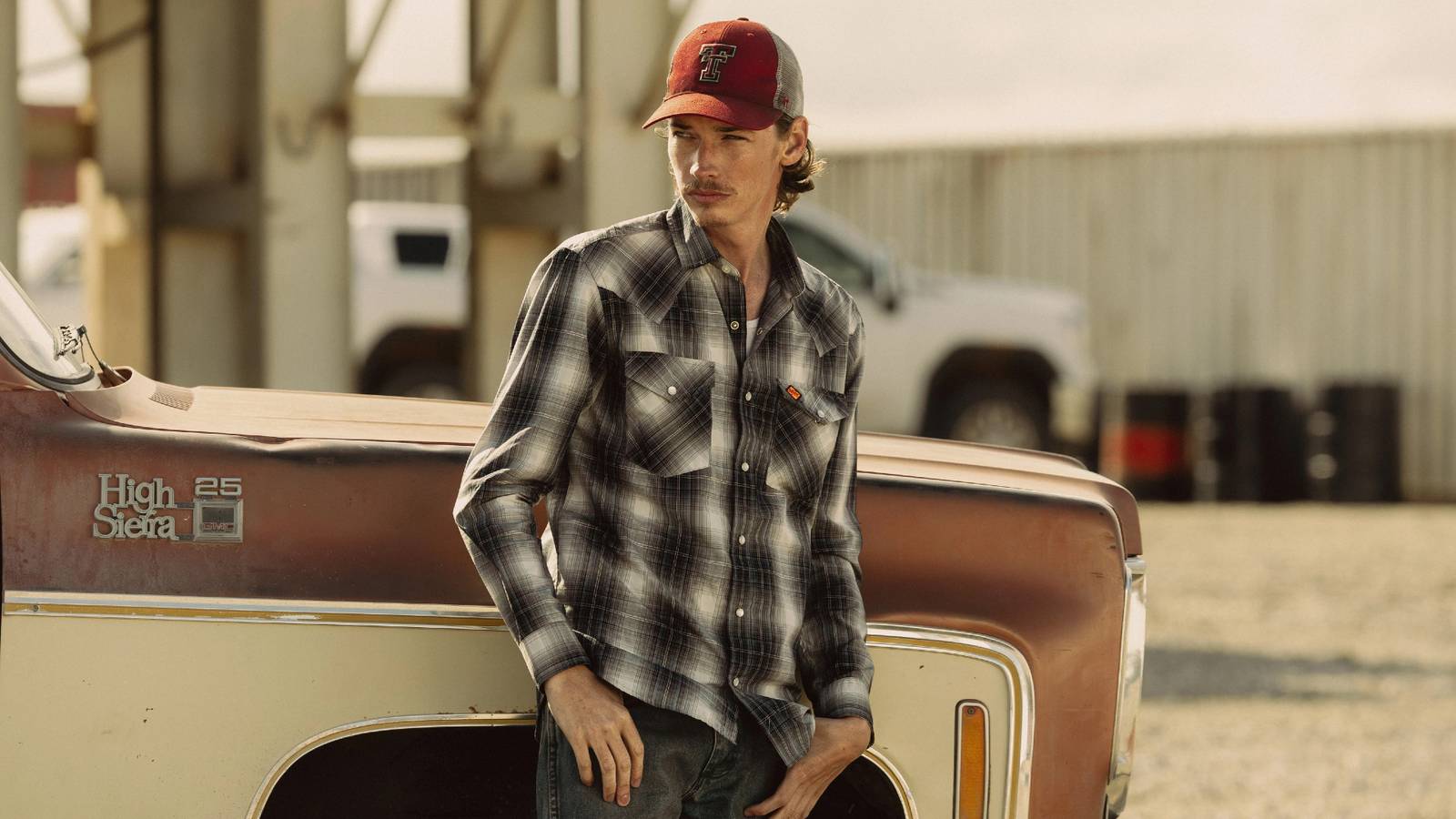 Jacob Lofland as Cooper leaning against a truck in Landman season 2