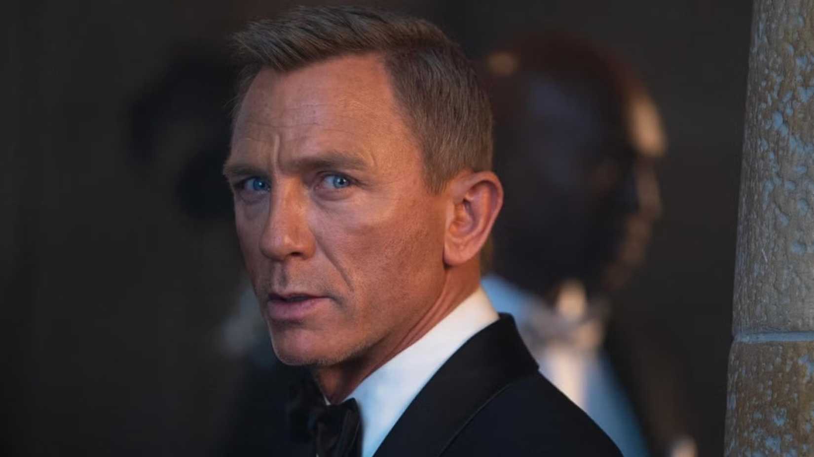 James Bond looks over his shoulder in Skyfall