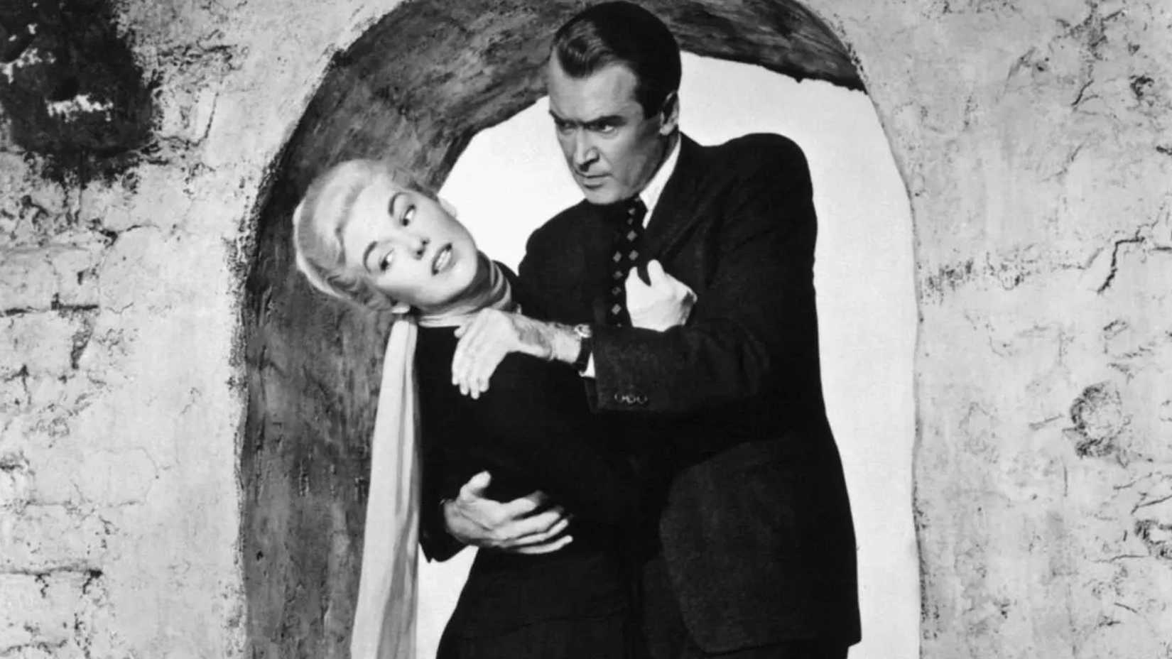 10 Thriller Movies That Are Amazing From Start to Finish 8 James Stewart as John Scottie Ferguson holding onto Kim Novak as Judy Barton in Vertigo
