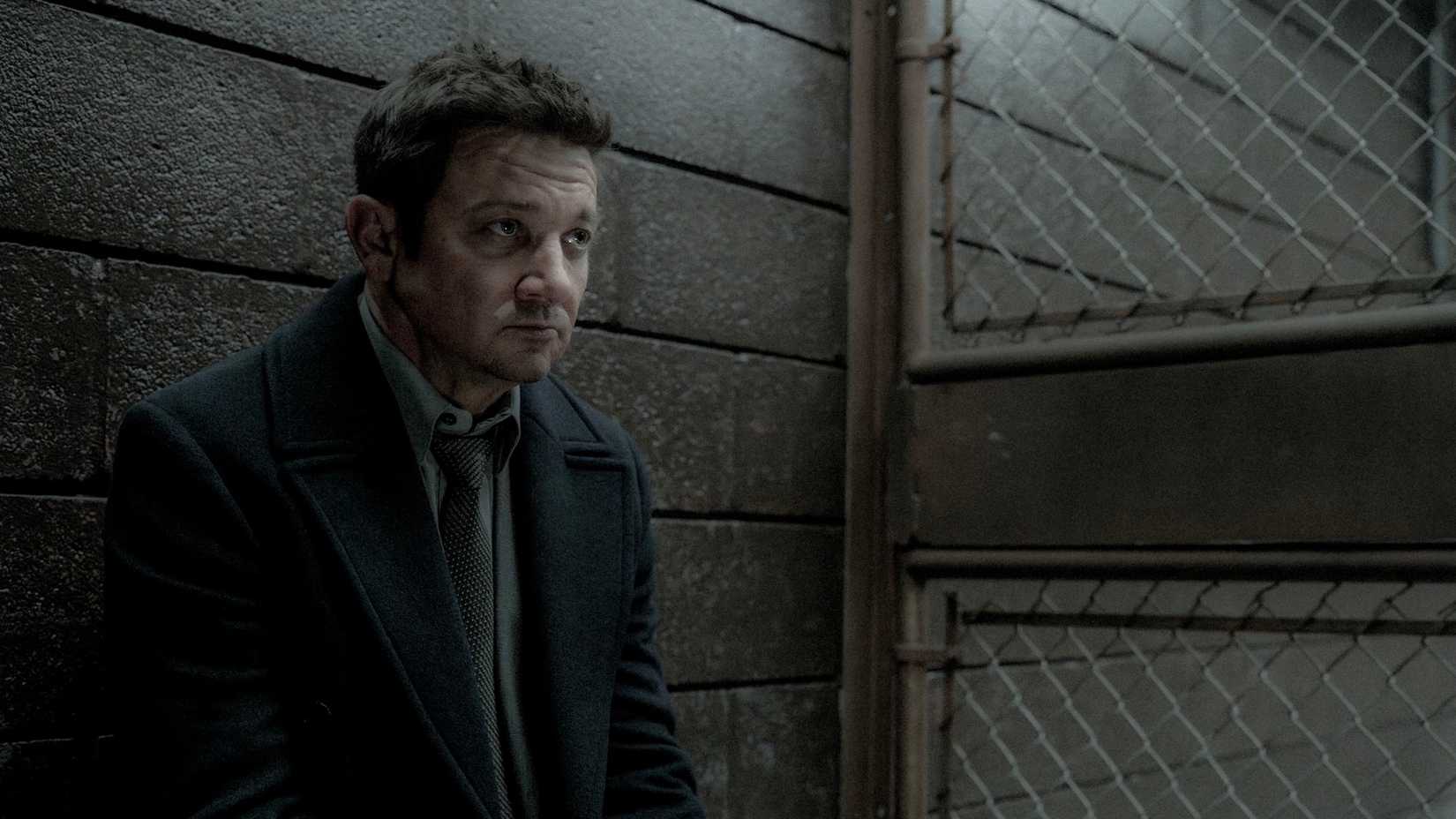 Jeremy Renner's McLusky sits in a prison cell in Mayor of Kingstown