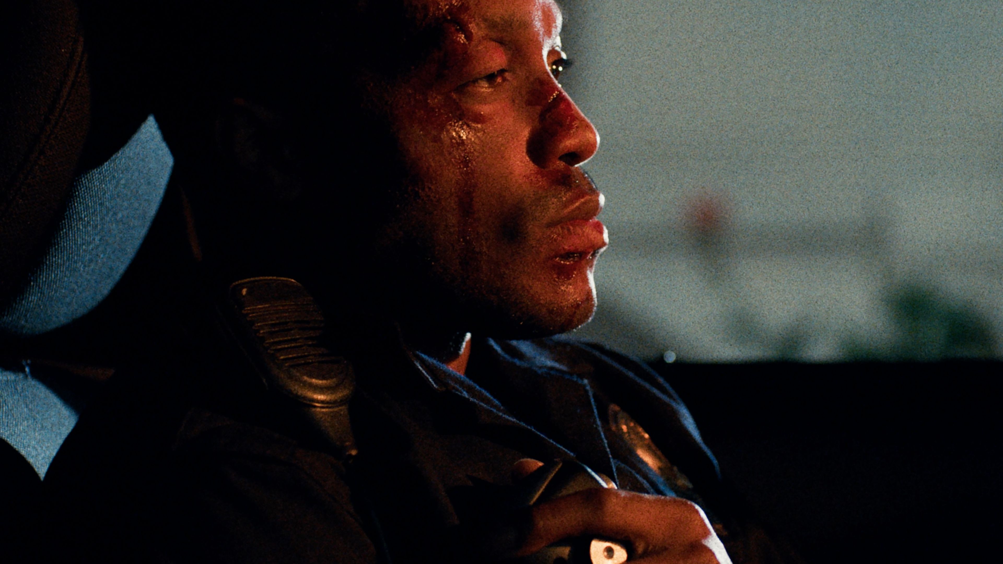 Jermaine Fowler's Xavier with his face beat up and sitting in a car in Night Patrol