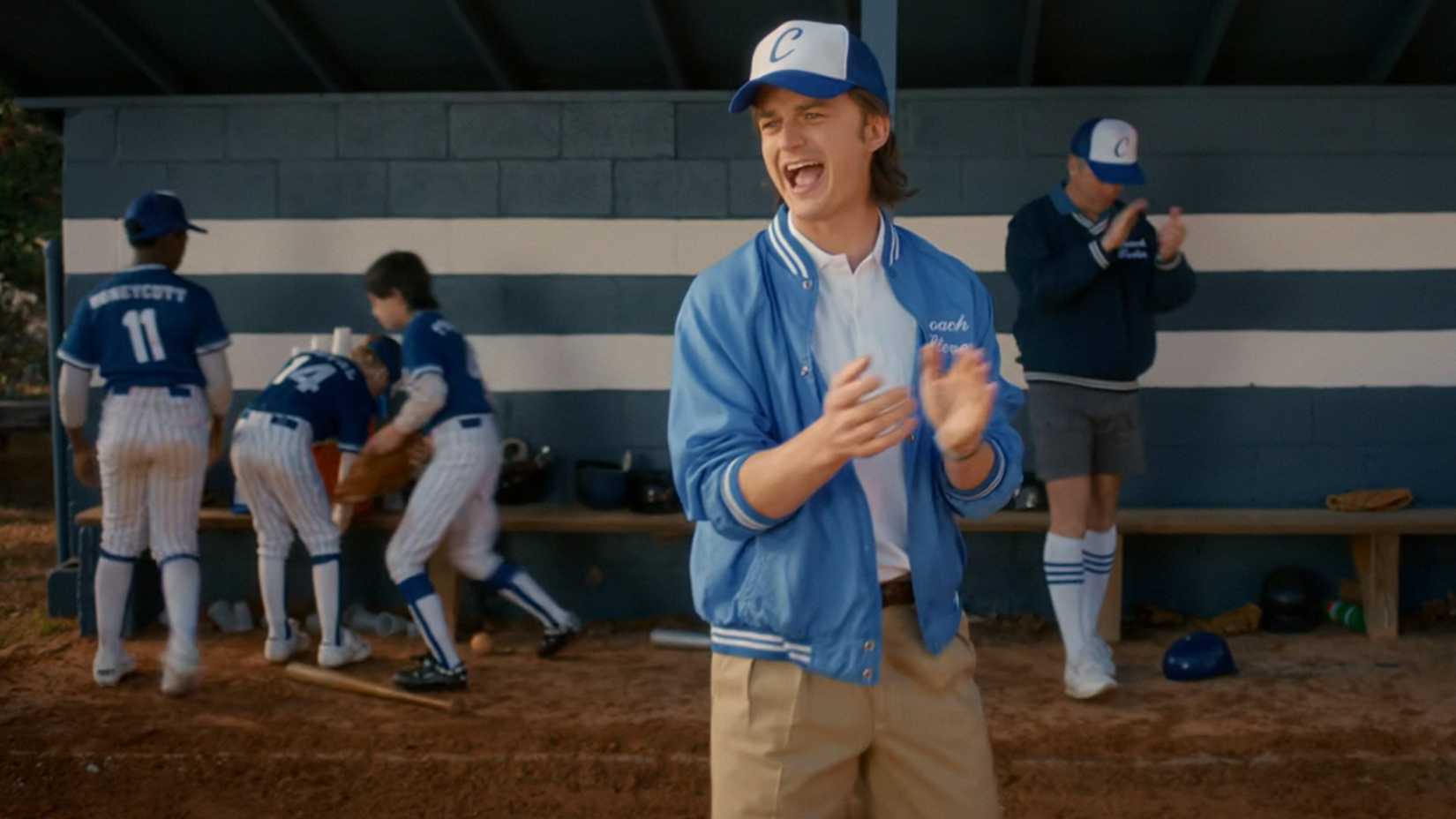Joe Keery as Steve Harrington coaches baseball in Stranger Things