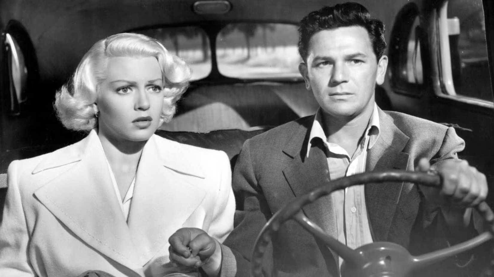 Lana Turner as Cora Smith and John Garfield as Frank Chambers in a car in The Postman Always Rings Twice