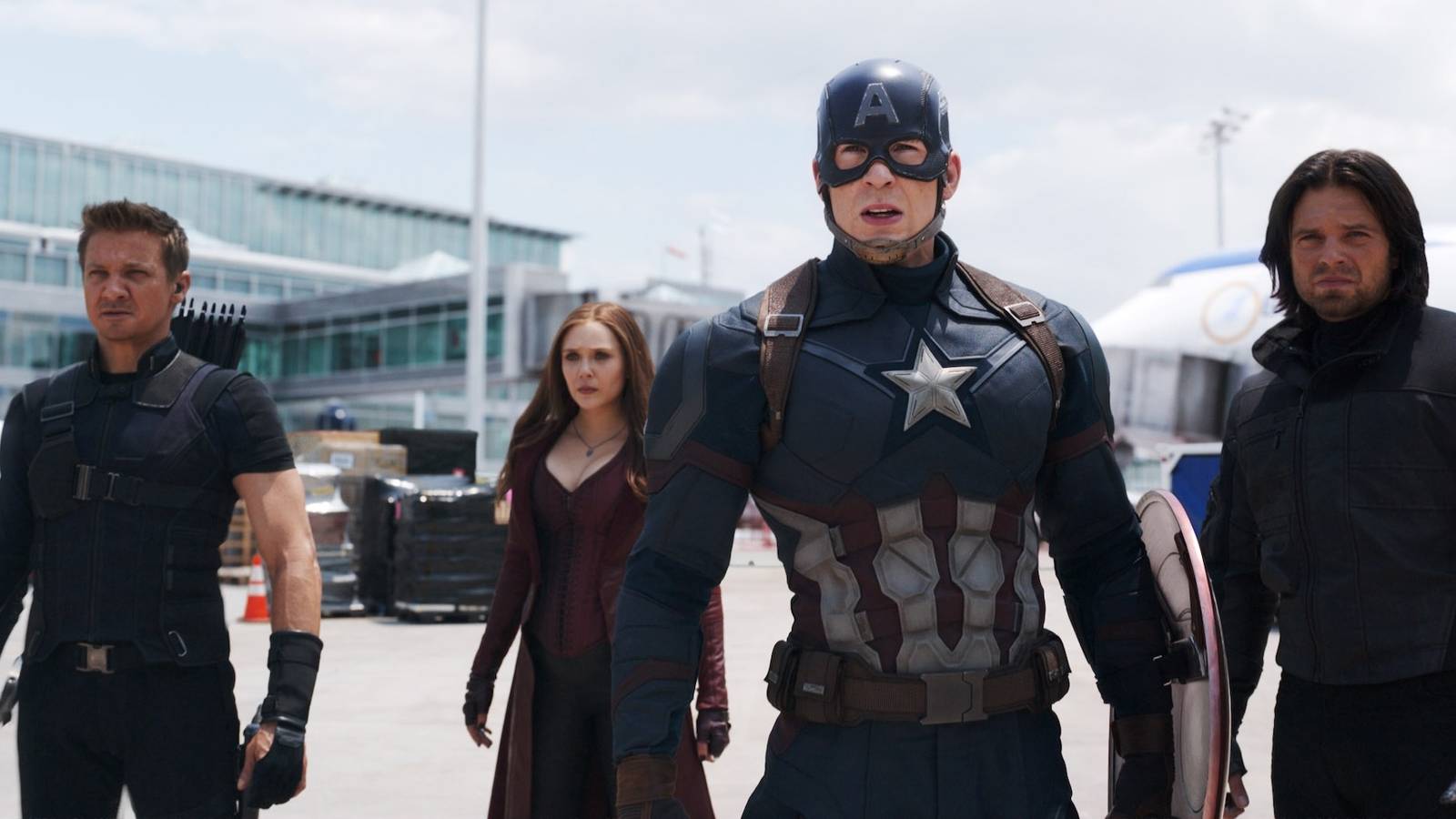 Jeremy Renner as Hawkeye, Elizabeth Olsen as Scarlet Witch, Chris Evans as Captain America, and Sebastian Stan as the Winter Soldier, getting ready to fight in Captain America: Civil War
