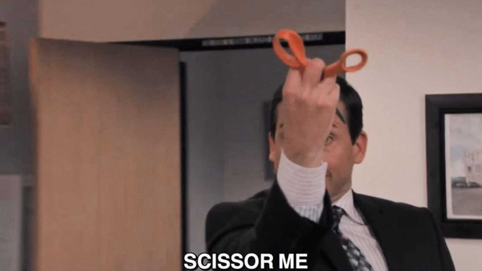 Michael grabs scissors in The Office