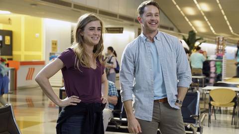 Michaela Stone (Melissa Roxburgh) and Ben Stone (Josh Dallas) smiling while at the airport in Manifest