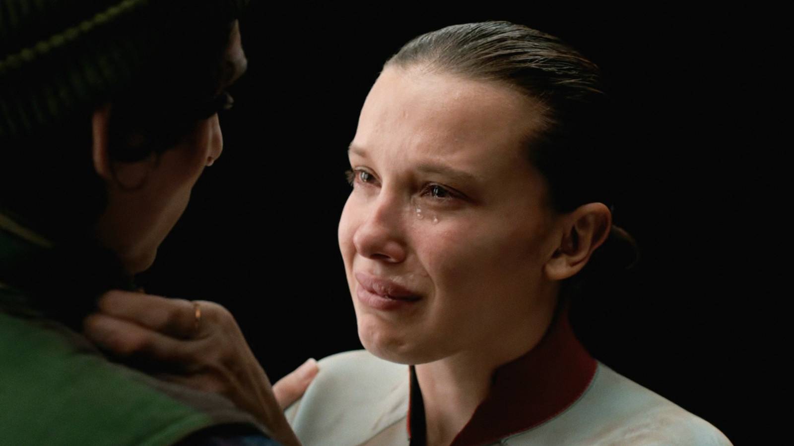 Millie Bobby Brown as Eleven crying while speaking to Mike in Stranger Things series finale