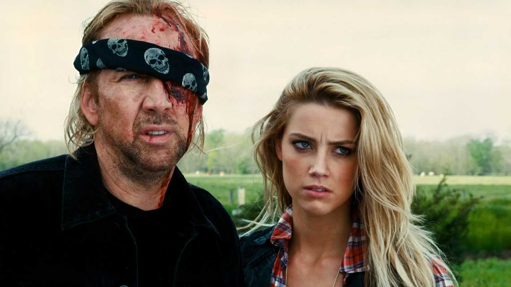 Nic Cage with a bloody eyepatch and Amber Heard in Drive Angry