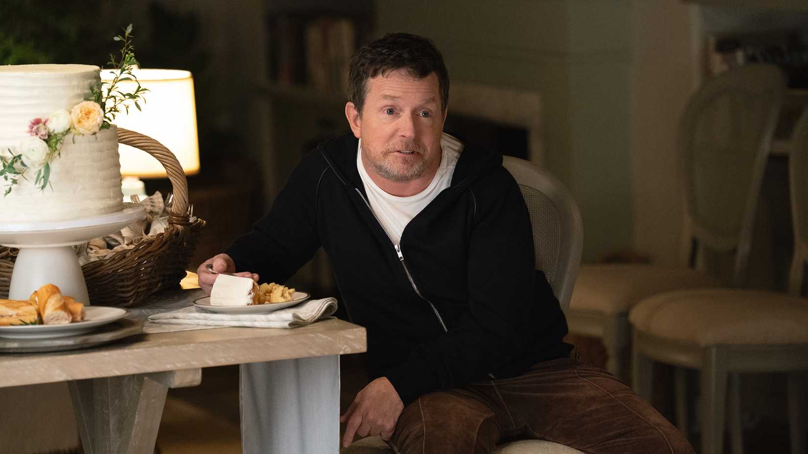 Michael J Fox eating cake in Shrinking season 3