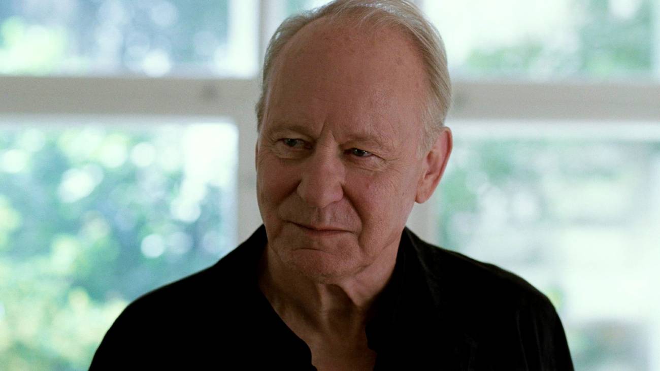 Stellan Skarsgård half smiling in Sentimental Value