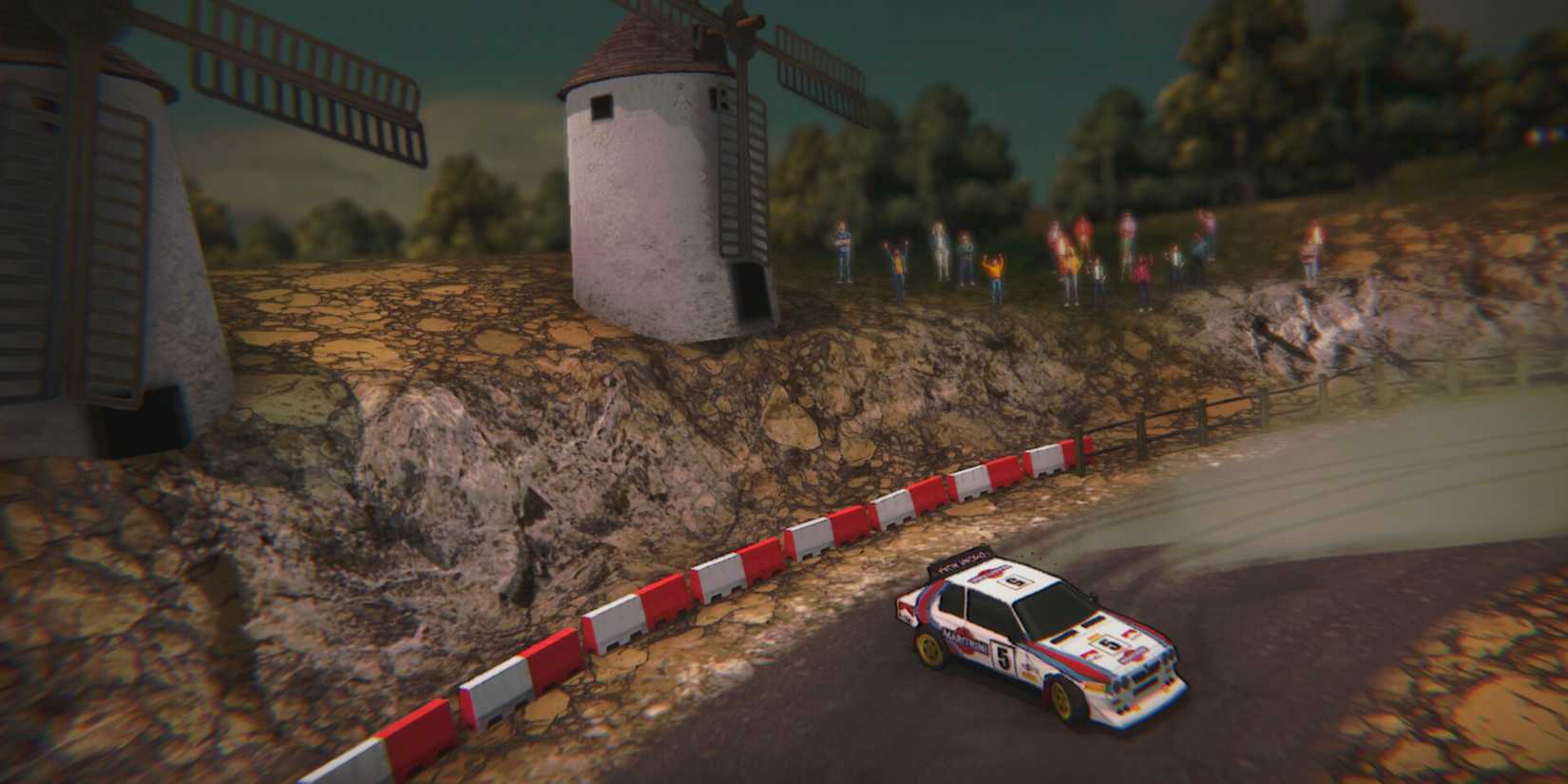 A car drifts as the crowd cheers in Super Woden Rally Edge.