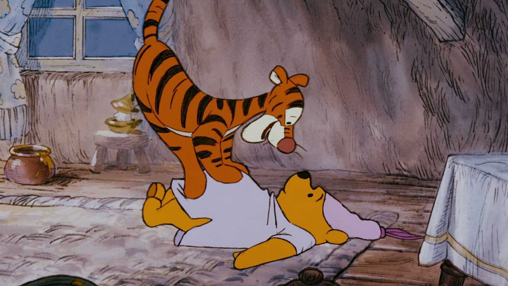 10 Disney Animated Movies Impossible To Adapt In Live-Action 2 Tigger pounces on Pooh in The Many Adventures of Winnie the Pooh