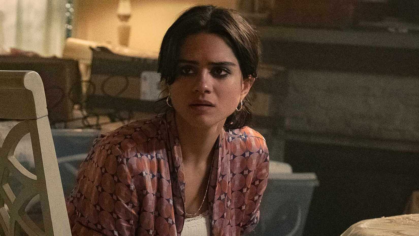 Desi looks on with tears in her eyes in The Rip