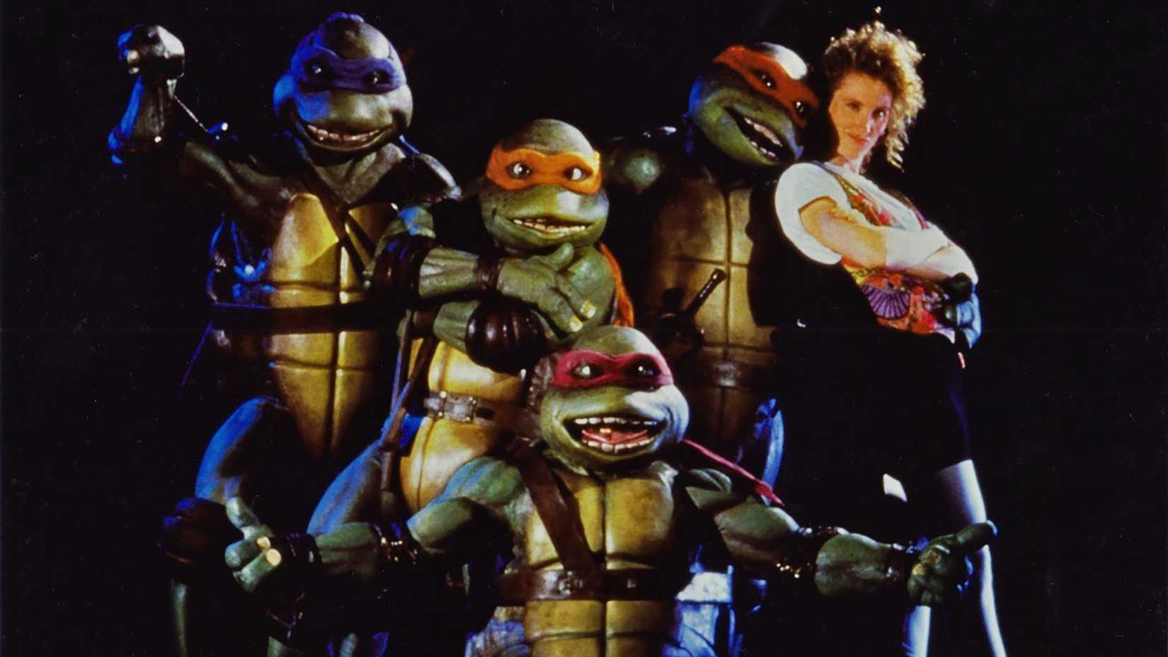 As Tartarugas Ninja e April O'Neil em sessão de fotos promocional do filme de 1990.