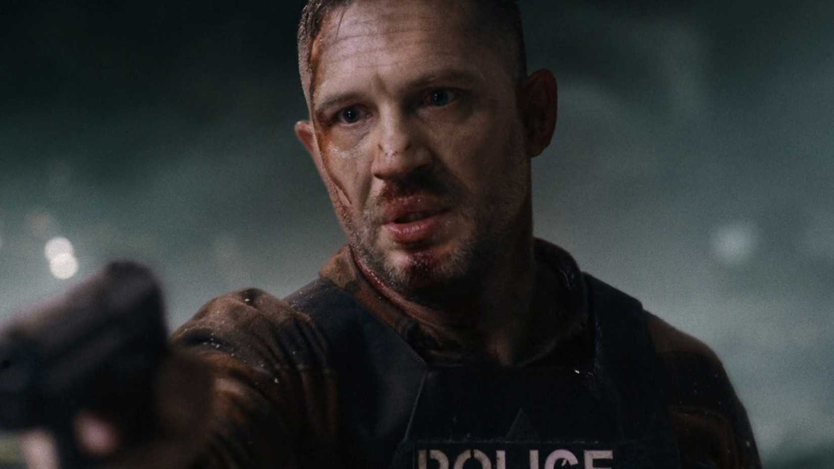 Tom Hardy/Patrick holding a gun in Havoc