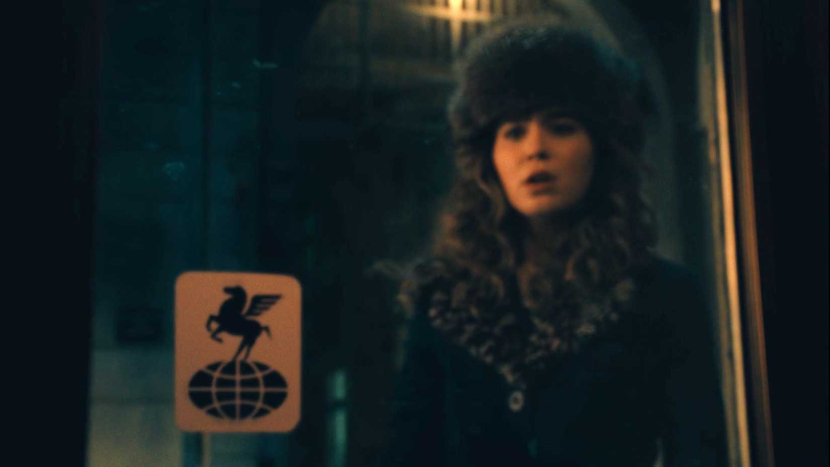 Twila looks at the Pegasus over the world symbol in Ponies season 1