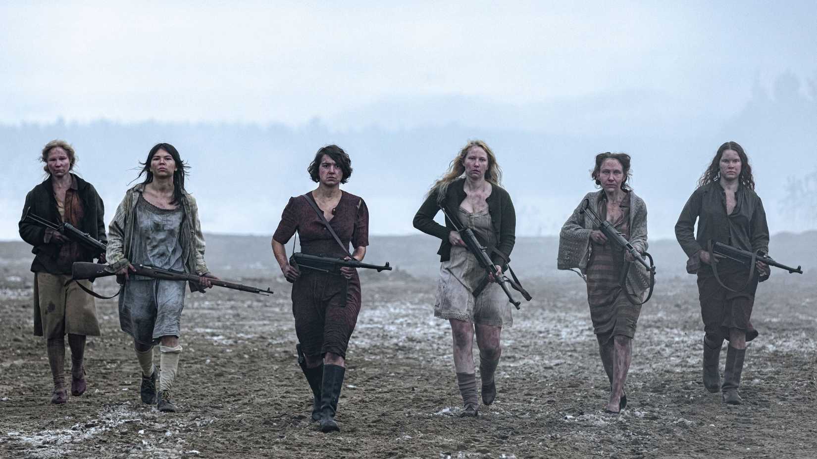 The freed women in Sisu, armed and walking toward the camera