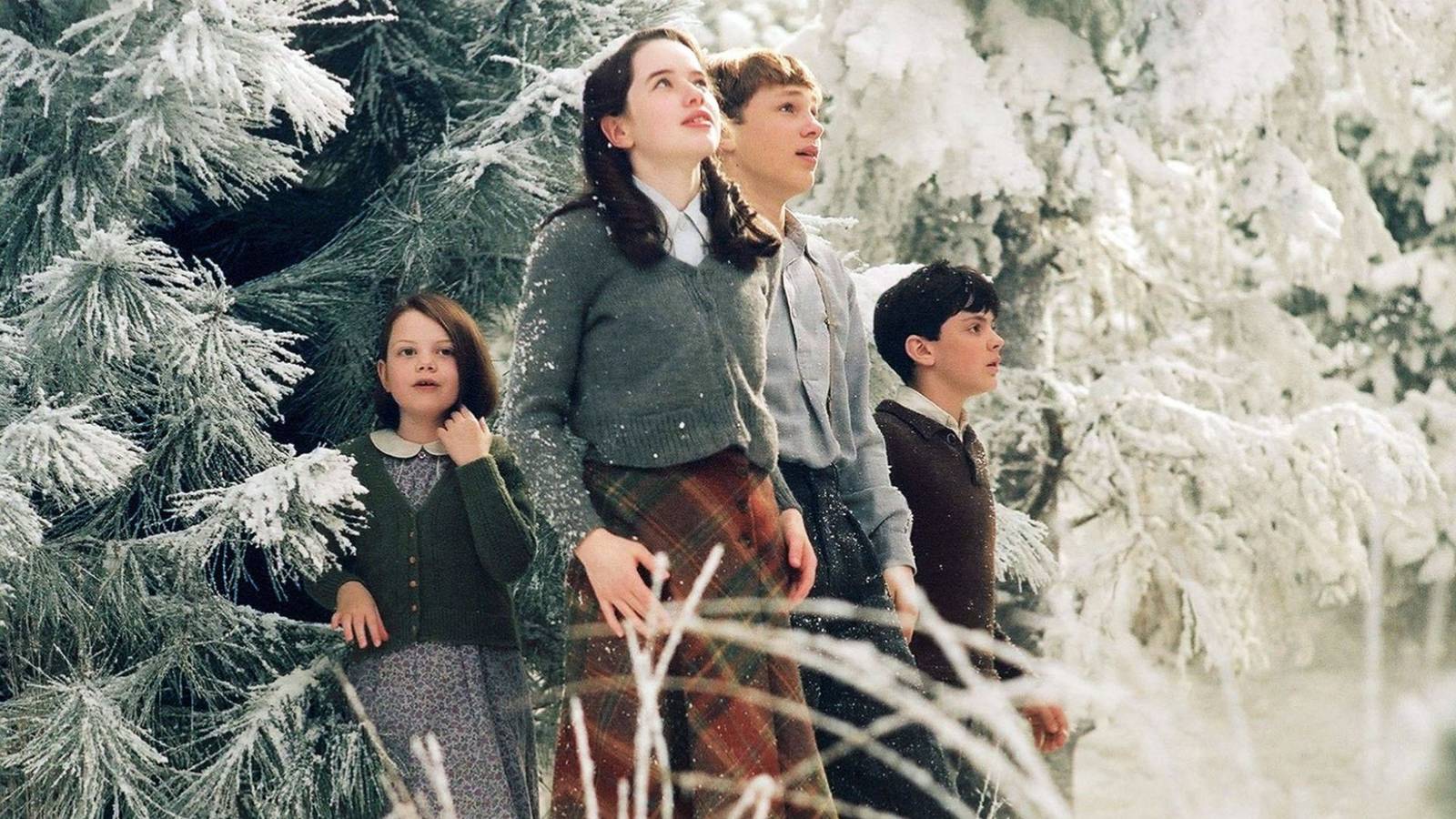 Lucy, Susan, Peter, and Edmund emerging into Narnia